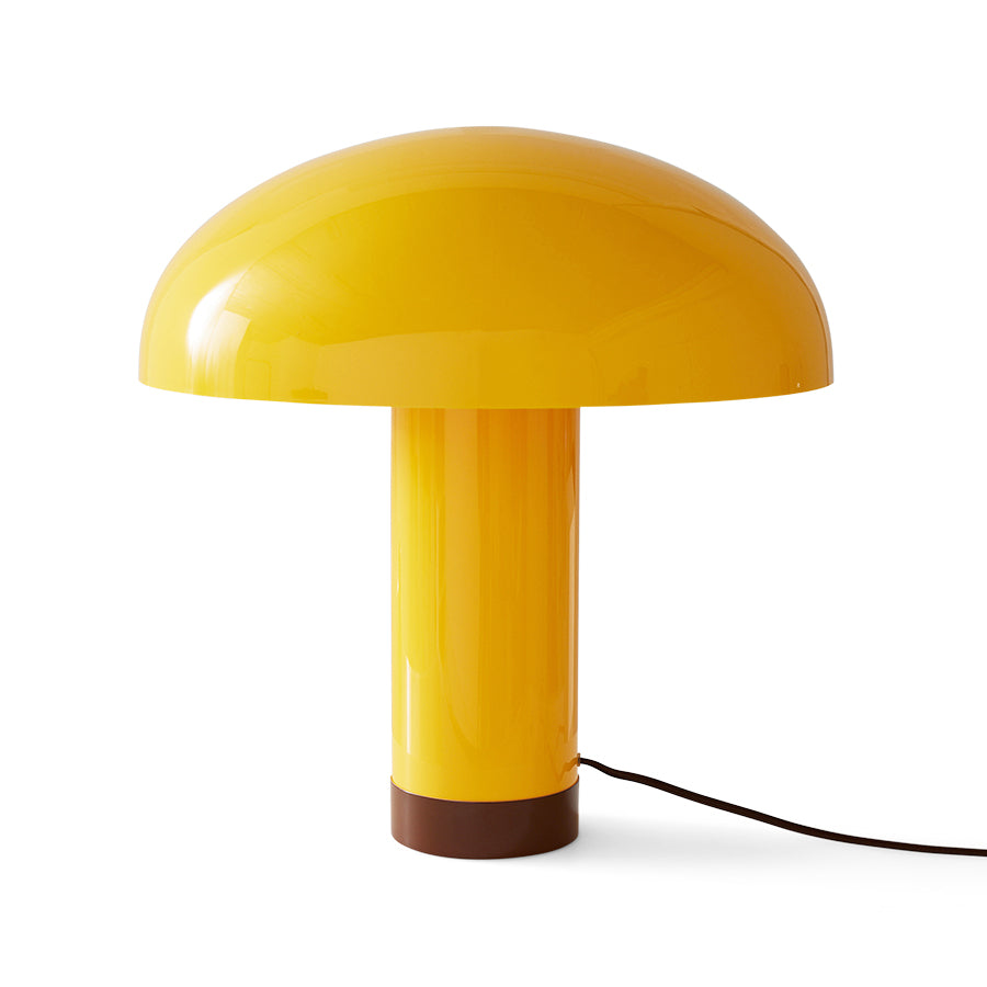 Yellow mushroom-shaped table lamp on a white background