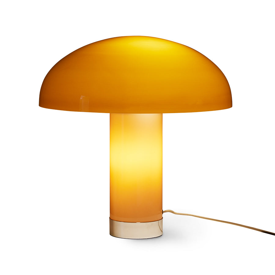 Yellow mushroom-shaped table lamp on a white background