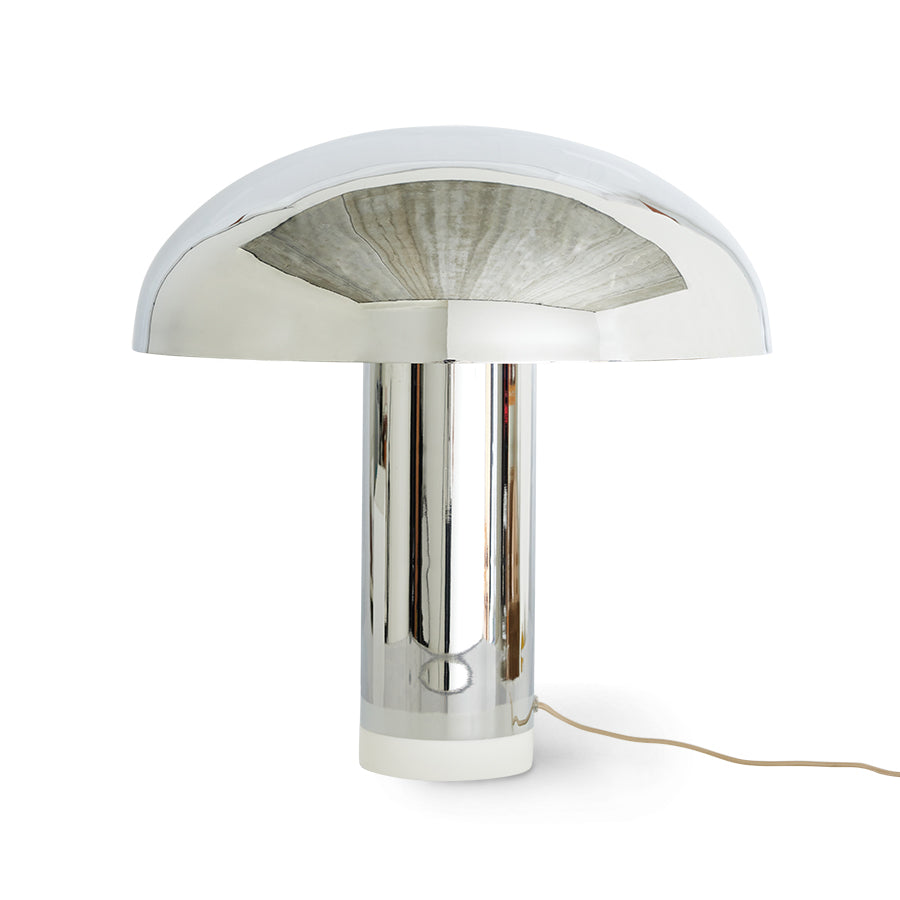 Modern table lamp with metallic finish on a white background