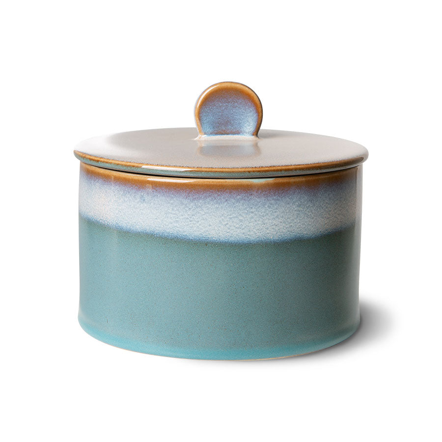 Ceramic jar with a lid on a white background